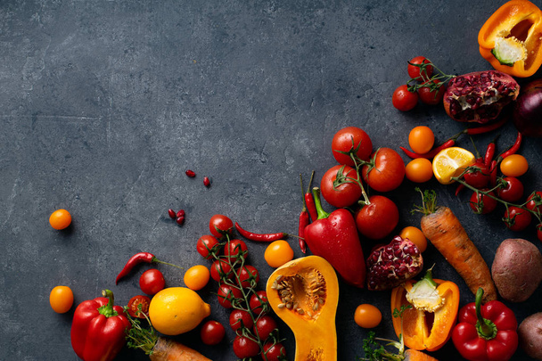 pile of fresh colorful vegetables on concrete grey background, Healthy food ingredients concept - Photo, Image