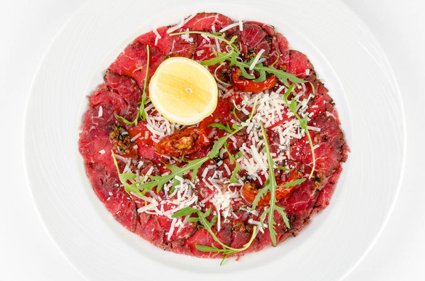 Carpaccio on a plate on a white background, top view - Foto, immagini