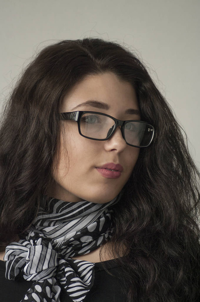 Portrait of a girl in glasses with long hair, - Fotografie, Obrázek
