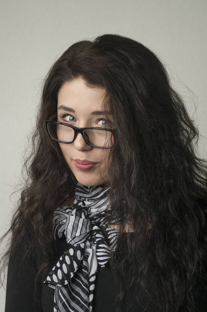Portrait of a girl in glasses with long hair, - Fotó, kép