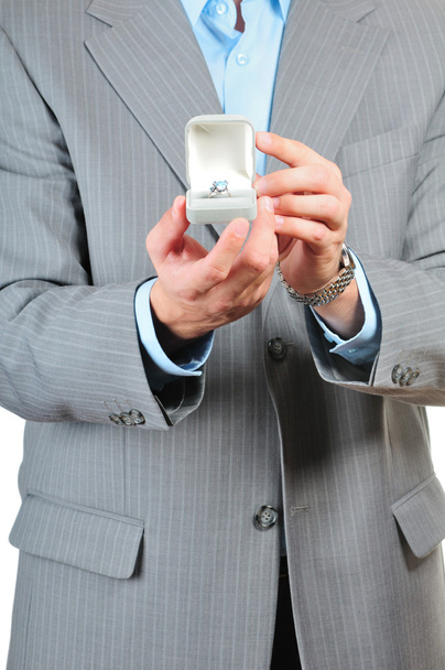 Man holding a gift box with jewelry - Foto, Imagen