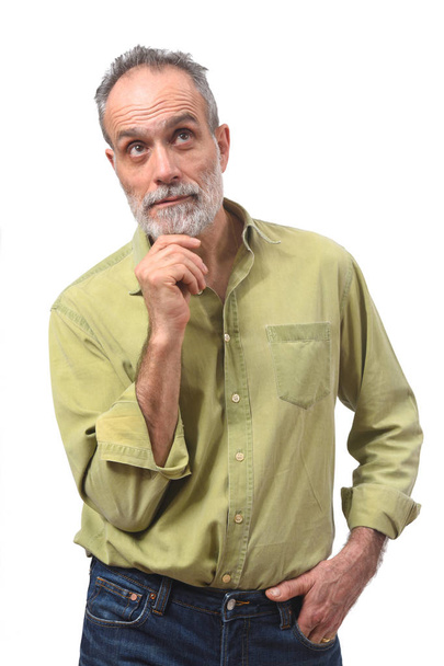 Mann mit Zweifeln oder Fragen auf weißem Hintergrund - Foto, Bild