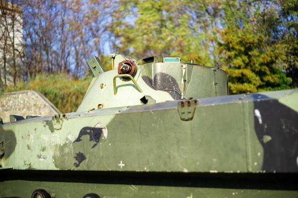 Damaged body of a military armored infantry. Part of  vehicle on photo. Outdoor military vehicles museum. Armor is damaged at the battlefield. - Photo, Image