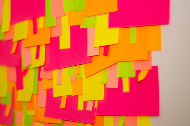Bright multi-colored stickers on the office white board. - Photo, Image