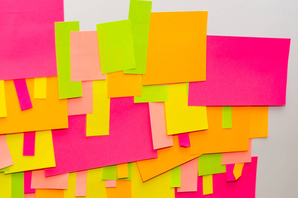 Bright multi-colored stickers on the office white board. - Foto, immagini