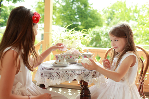 Outdoor image of beautiful little girls with tea - Φωτογραφία, εικόνα