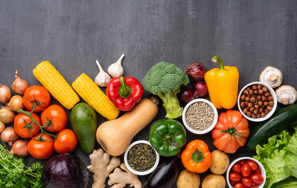Healthy eating ingredients: fresh vegetables, fruits and superfood. Nutrition, diet, vegan food concept. Concrete background - Foto, imagen
