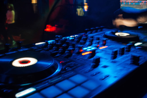professional DJ mixer controller in night club - Foto, Bild