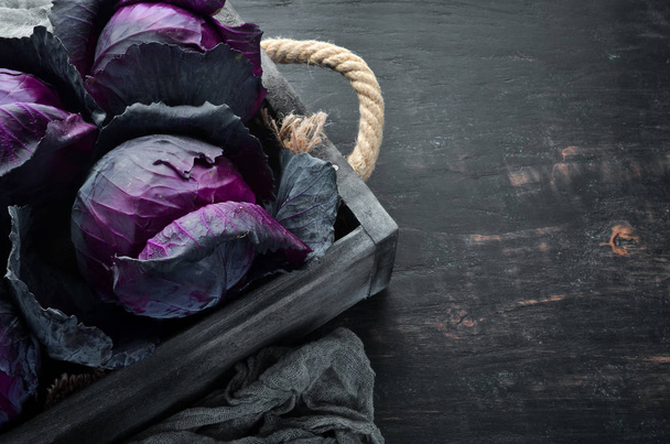 Purple cabbage in a wooden box. Organic food. Top view. Free space for your text. - Fotoğraf, Görsel