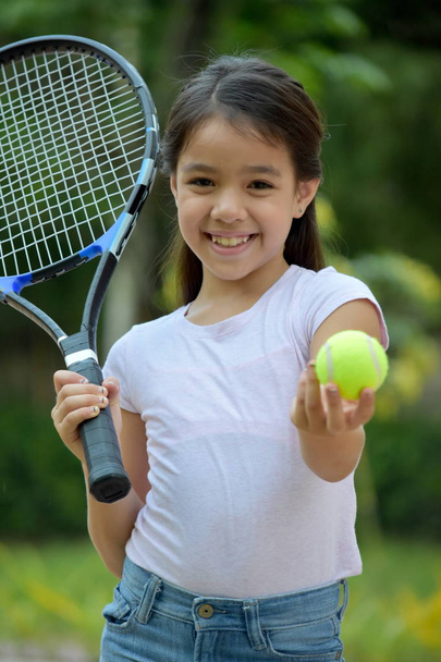 Minority Child Athlete And Happiness With Tennis Racket - Valokuva, kuva