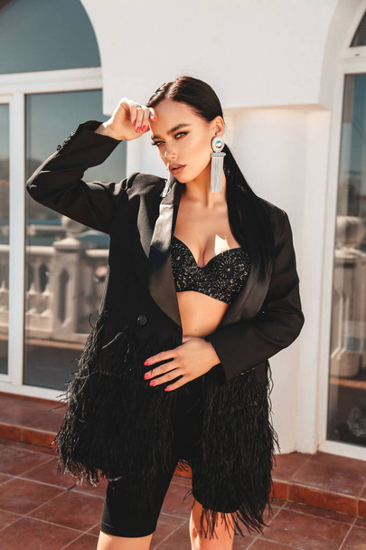 beautiful sexy woman with dark hair in luxurious clothes - Fotoğraf, Görsel