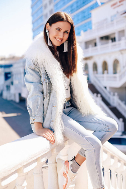 beautiful sexy woman with dark hair in elegant jeans jacket and  - Fotografie, Obrázek