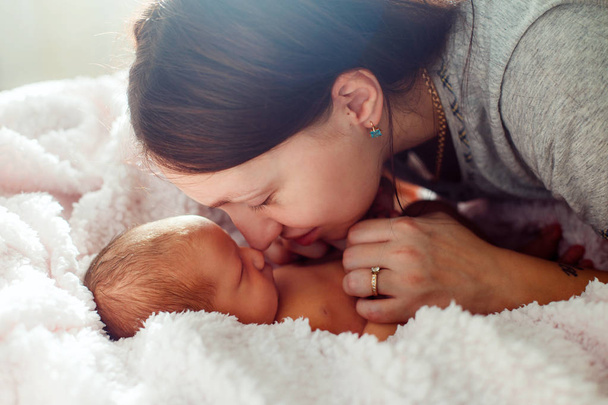Mom and newborn baby on white background - Zdjęcie, obraz