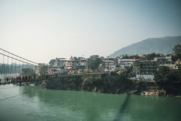 Lakshman Jhula is an iron suspension bridge situated in Rishikesh, - Photo, Image