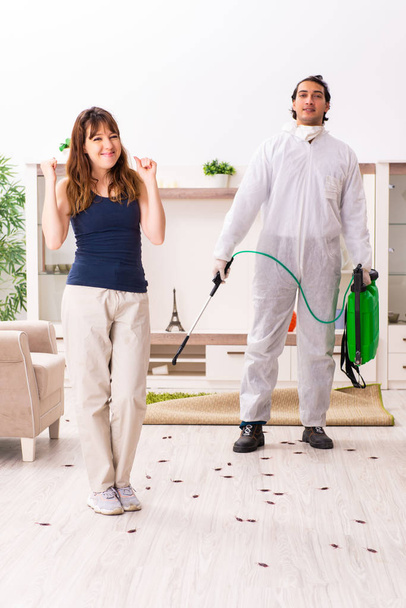 Young professional contractor doing pest control at flat  - Photo, Image
