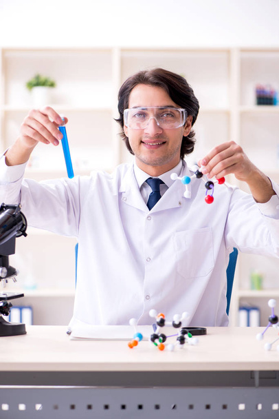 Young male scientist working in the lab  - Фото, зображення