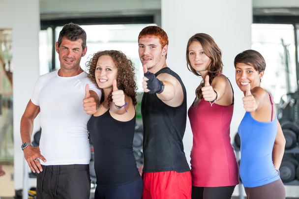 Group of at Gym with Thumbs Up - Foto, immagini