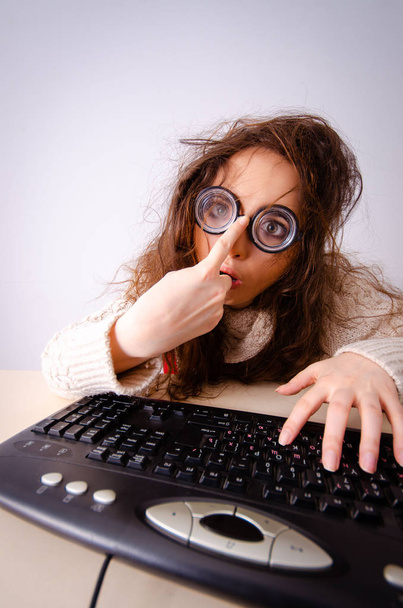 Funny nerd girl working on computer - Photo, Image