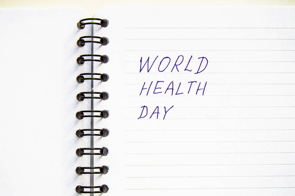 Written world health day, spiral notebook, copy space, health concept, flat lay - Foto, Imagem