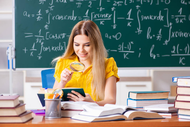 Young female student in front of the chalkboard   - Photo, Image