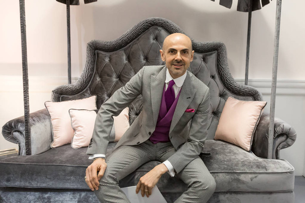 Fashion designer Enzo Miccio posing at S�� Sposaitalia 2019 in M - Zdjęcie, obraz