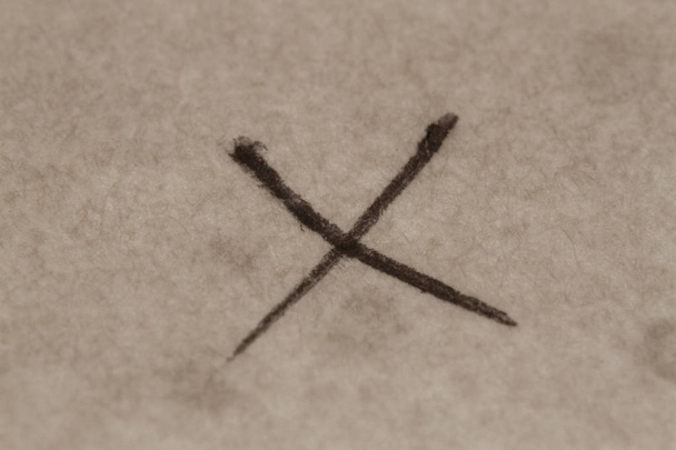 Cross mark handwriting on the old paper - Photo, Image