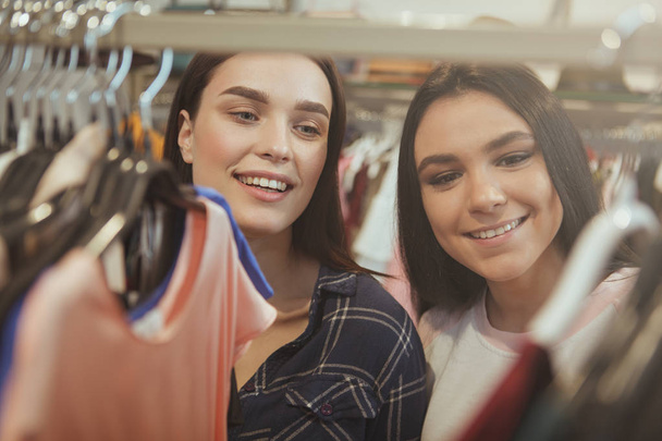 Beautiful women enjoying shopping for clothes together - Zdjęcie, obraz