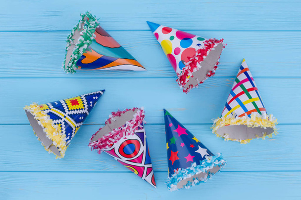Assorted party hats on blue background. - Photo, Image