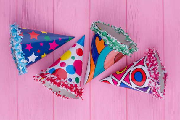 Decorated party hats on color background. - Photo, Image