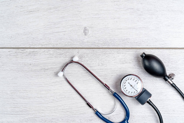Medical stethoscope on gray wooden background - Photo, image