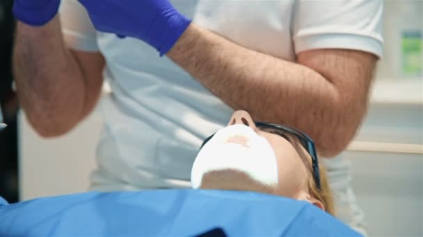 Dentist Treating A Woman Patient.  Treating A Patient In Modern Dental Clinic. - Materiał filmowy, wideo
