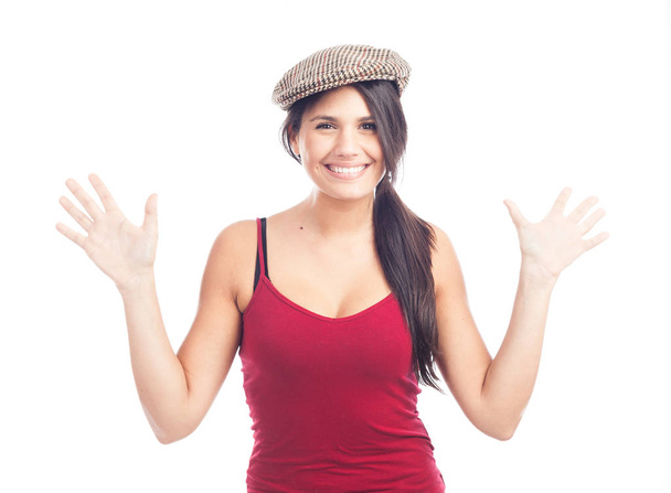 pretty smiling and cheerful brunette woman with french cap and red tank top - Fotó, kép