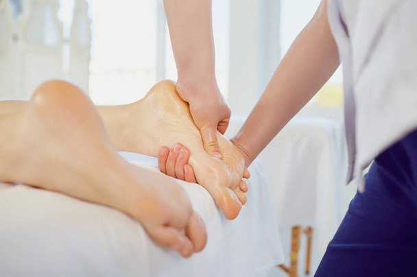 Foot massage in the spa salon. - Фото, изображение