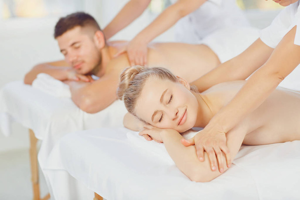 Couple enjoying massage body at the spa center - Foto, Imagem