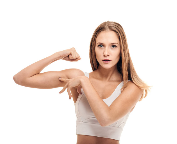 Woman showing her biceps - Фото, изображение
