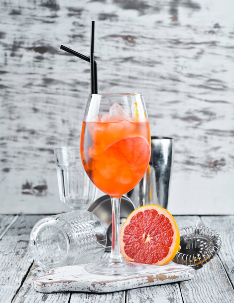 Cocktail Aperol Sprits. Alcoholic cocktail. On a wooden background. Top view. Free copy space. - 写真・画像