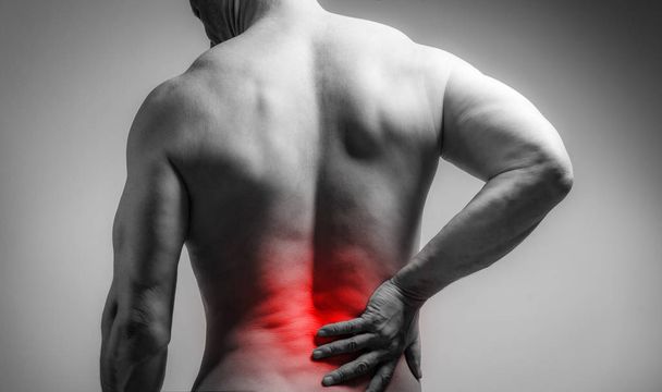 Muskelmann mit Rückenschmerzen - Foto, Bild