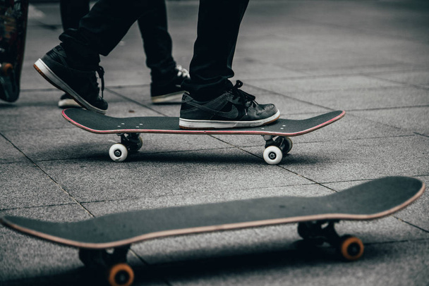 Skateboarders skateboarding in a skatepark - Fotó, kép