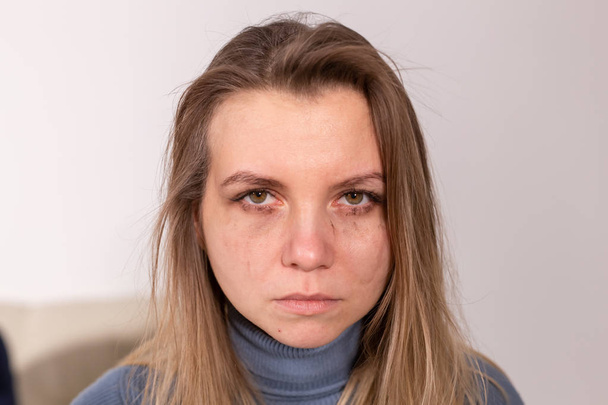 violence issues - Woman victim of domestic violence and abuse over grey background - Fotografie, Obrázek