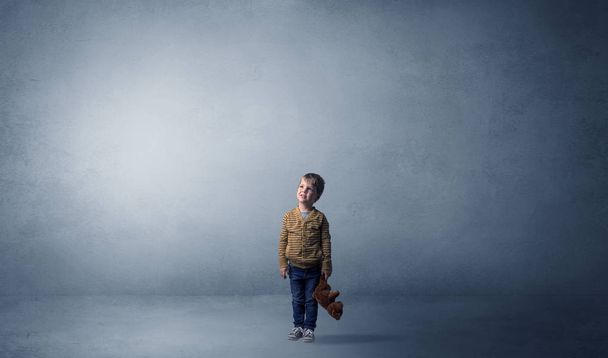 Little waggish kid in an empty room - Photo, image