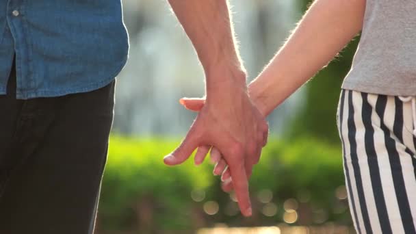 Young couple joining hands outdoors. - Footage, Video