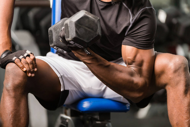 Black African American  young man doing  workout at the gym - Photo, Image
