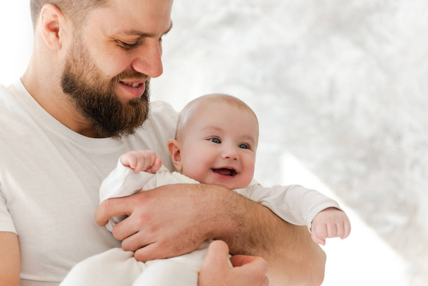 Father and baby girl on white background - Zdjęcie, obraz