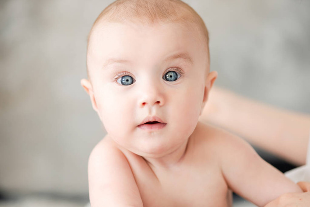 Portrait of a cute baby girl with blue eyes. - Photo, Image