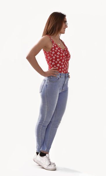 Woman wearing jeans and red top on white background - Foto, Imagen