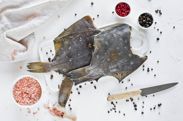 Raw flounder, ingredients for cooking. White background, top view,. - Photo, Image