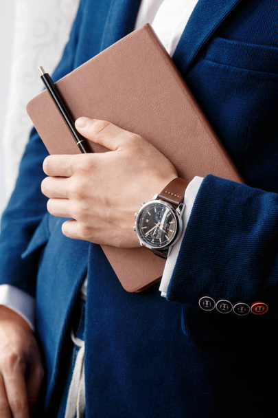 hand of businessman with clock closeup - Foto, Imagen