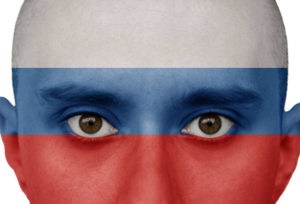 National flag Russia colored depicted in paint on a man's face close-up, isolated on a white background - Fotoğraf, Görsel