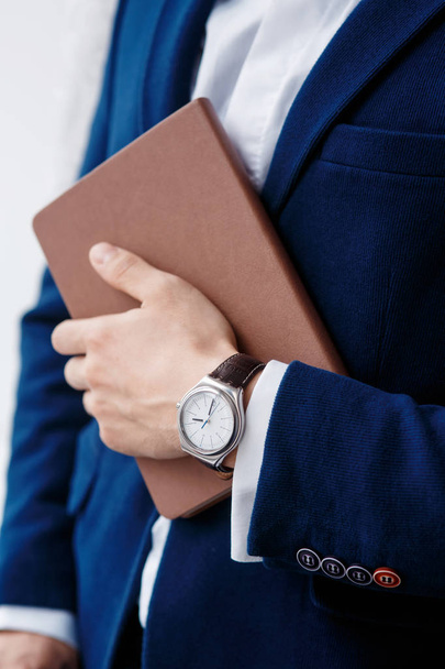 hand of businessman with clock closeup - Fotó, kép