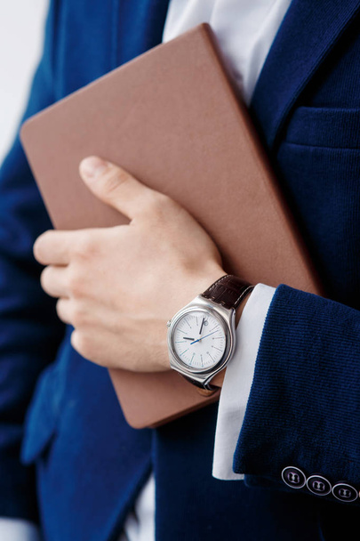 hand of businessman with clock closeup - Valokuva, kuva